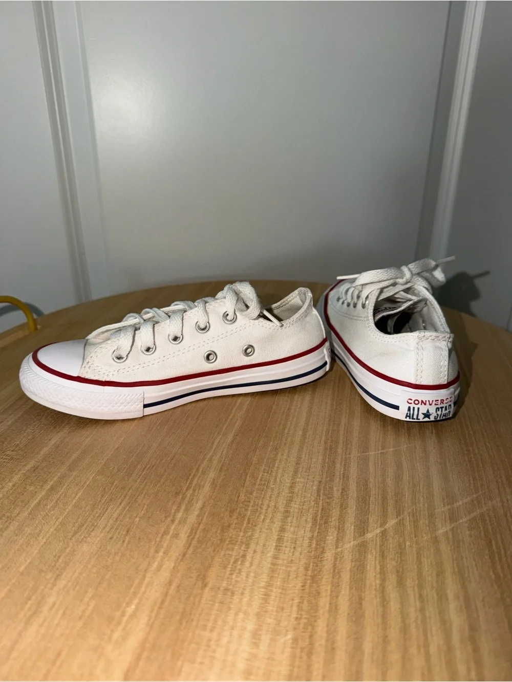 Converse Low Top Canvas Sneakers in White with Red Trim